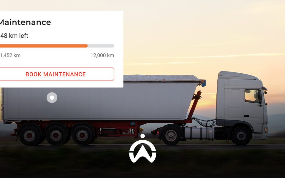 A white truck driving on a road at sunset, displaying a maintenance progress bar indicating 548 km left until service.