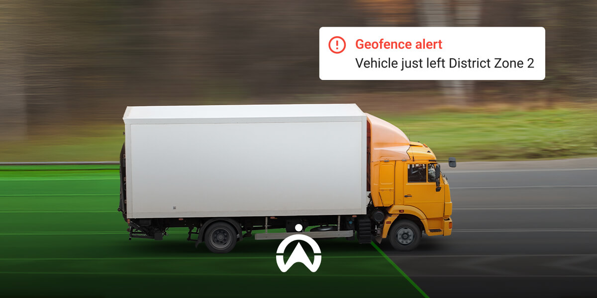 A yellow truck departs a designated zone, triggering a geofence alert notification about leaving District Zone 2.