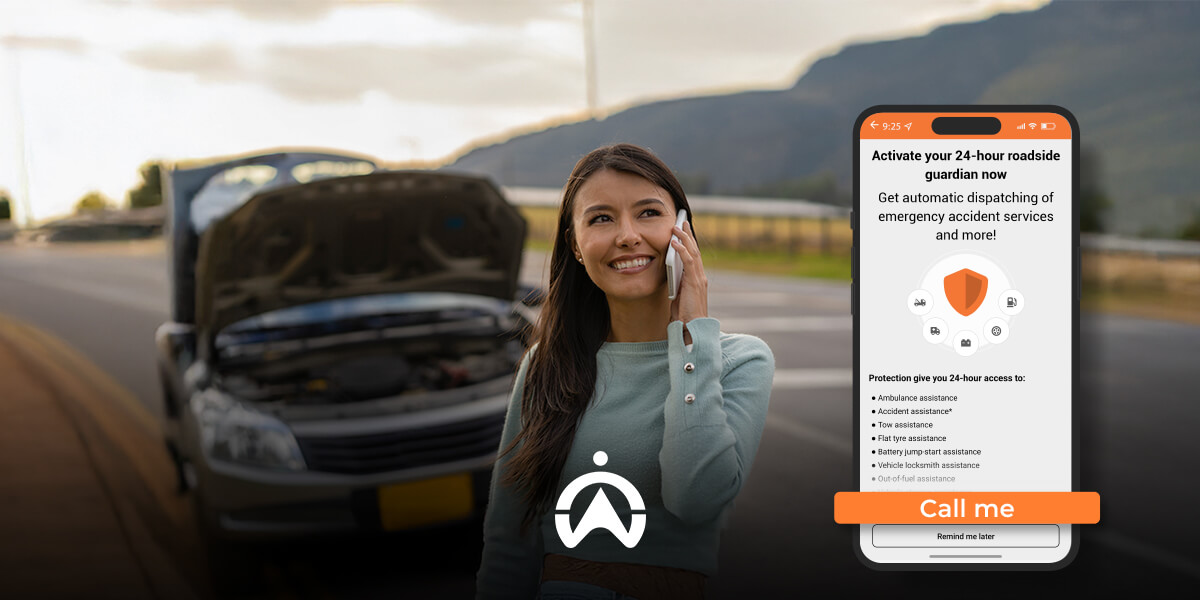 A woman stands beside a broken-down car, holding a phone, with a roadside assistance app displayed on her phone screen.