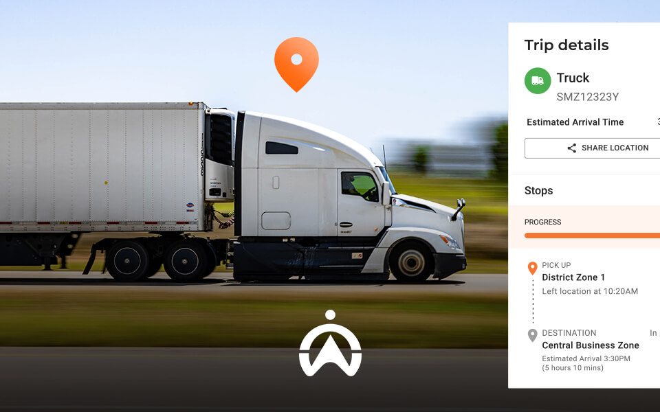 A white semi-truck drives on a highway, displaying real-time trip details including stops and estimated arrival time.