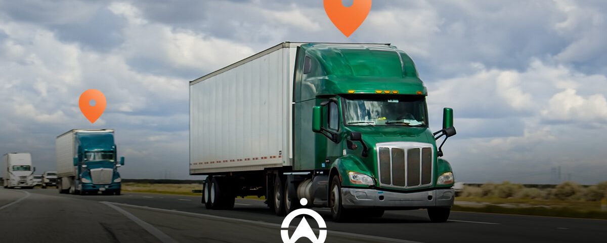 Two green semi-trucks drive on a highway under a cloudy sky, with location markers above them symbolizing tracking.